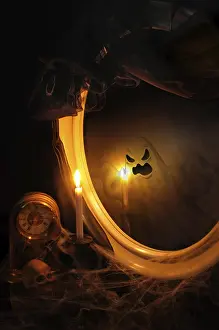 Abandoned Table Setting Impressions: Ghost reflection in the mirror on the table with a candle