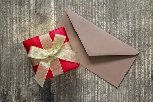 Gift Giving Ideas Impressions: Gift or present box and envelope on the table
