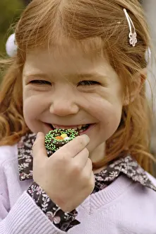 Easter Sweets Impressions: Girl eats sweets at easter time