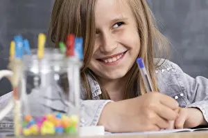 Primary School Education Impressions: The girl solves the task given in the classroom