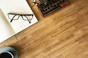 Symbolic Picture Impressions: Glasses on the notebook on the table