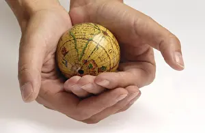 Hand Holding Globe Impressions: Globe