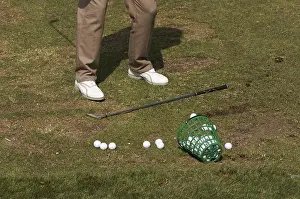 Recreational Golf Activity Impressions: Golfer practicing his swing at the range