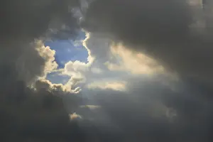 Northern Europe Weather Impressions: Gray sky with clouds and sun rays