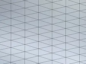 Contemporary Decorative Item Impressions: A gray surface featuring a modern geometric pattern composed of interconnected triangles