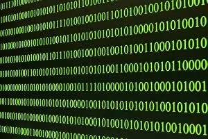 Green Binary Code Impressions: Green binary code arranged in rows on a black background