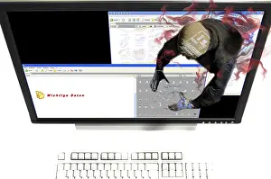 Hacker Attack Impressions: A Hacker from the Internet is stealing or destroying important data on the harddisk