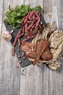 Pork Meat Products Impressions: Ham and different vegetables on a studio background