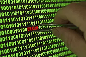 Computer Crime Scene Impressions: Hand reaching for the word 'Error' with tweezers in a binary code Hand reaching for the word