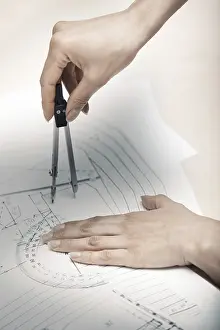 Construction Project Planning Impressions: Hands of engineer working on a construction plan