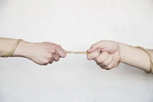 Teamwork Concept Impressions: Hands pulling rope