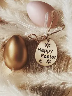 Easter Egg Symbolism Impressions: Happy Easter. Golden easter egg on rustic background