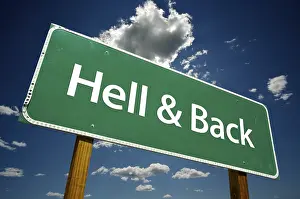 Cloudy Dramatic Sky Image Impressions: Hell and back road sign with dramatic clouds and sky