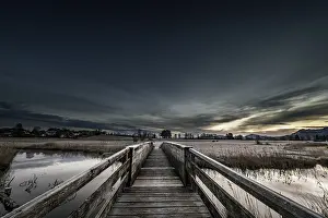 Bavarian Winter Landscape Impressions: Holzsteg over the Ach with reflection and dramatic sky
