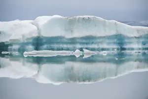 Glacier Lake Reflections Impressions: Ice formations are reflected in the still
