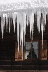 Europe Winter Landscape Photography Impressions: Icicles in front of a window