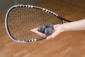 Fitness Exercise Impressions: Image of racket and three squash balls