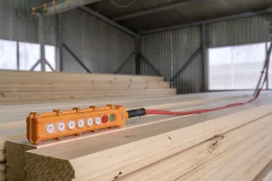 Timber Industry Equipment Impressions: Image of remote control for crane loading timber
