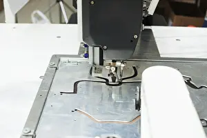 Handicraft Industry Equipment Impressions: Image of sewing machine stitching on patterns