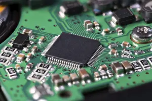 Printed Circuit Board Image Impressions: Integrated circuit with a processor chip on computer mainboard