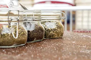 Alternative Medicine Tea Impressions: Jars with three different types of tea are on the table