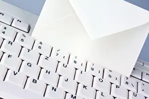 Email Communication Impressions: The keyboard of a computer and an envelope