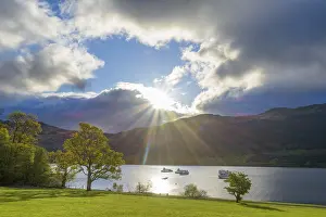 Dramatic Clouds Landscape Impressions: Lake with dramatic clouds and sun in spring