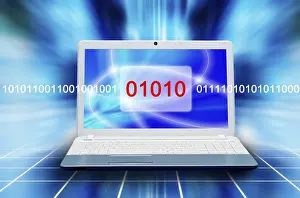 Digital Information Security Impressions: Laptop displaying binary code and abstract blue glow