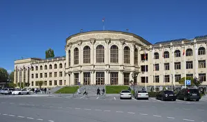 Flag Waving In The Wind Impressions: A large classical building with flags