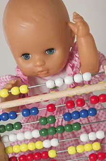 Educational Institution Image Impressions: Learning arithmetics, doll using an abacus