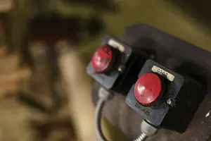 Industrial Building Architecture Impressions: Machine control panel with two red buttons