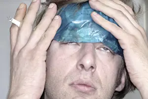 Migraine Pain Relief Impressions: Man with a coolpack