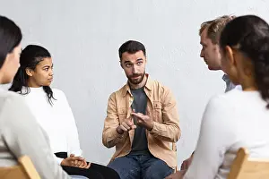 Group Therapy Session Impressions: Man explaining his problems group therapy session