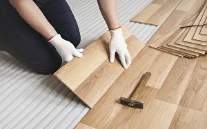 Parquet Floor Design Impressions: Man installing laminated floor