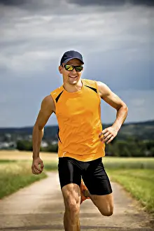 Athletic Man Impressions: Man jogging through the fields