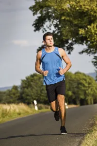 Fitness Man Impressions: Man jogging through the fields