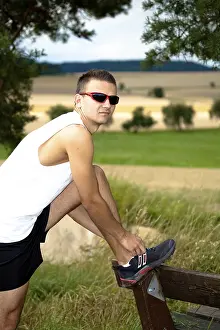 Outdoor Recreational Activity Impressions: Man jogging through the fields