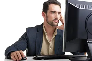 Professional Man At Work Impressions: Man looking at a computer screen