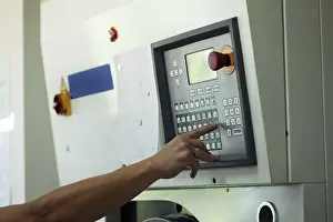 Passenger Traffic Control Impressions: Man presses button on electronic control panel