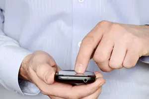 Man Using Smartphone Impressions: Man using a smartphone