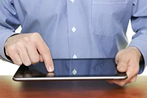 Tablet Pc Usage Impressions: Man using a tablet computer