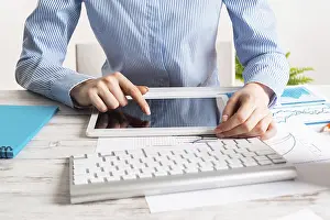 Business Accounting Impressions: Manager using tablet computer with blank screen