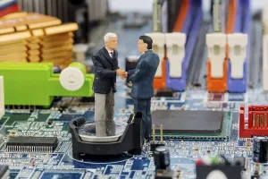 Printed Circuit Board Image Impressions: Two managers on computer board