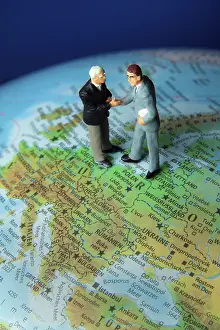 World Map Navigation Impressions: Two managers on one globe. Globalisation