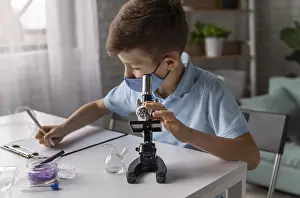 Classroom Education Impressions: Medium shot kid learning with microscope