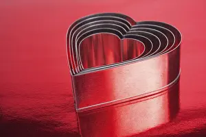 Symbolic Picture Impressions: Some of the metal hearts shaped over red background