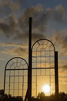 Lower Saxony Views Impressions: Two metallic window frames stand out against the dramatic sunset sky