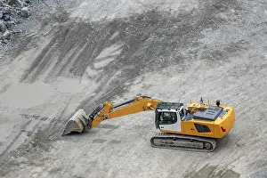 Mining Industry Equipment Impressions: Mining in the granite quarry. Working mining machine