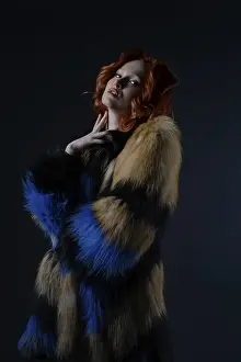 Fashionable Female Impressions: Model stands gracefully in a studio