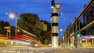 Road Safety In Europe Impressions: Moving trams at an intersection with a speed camera column